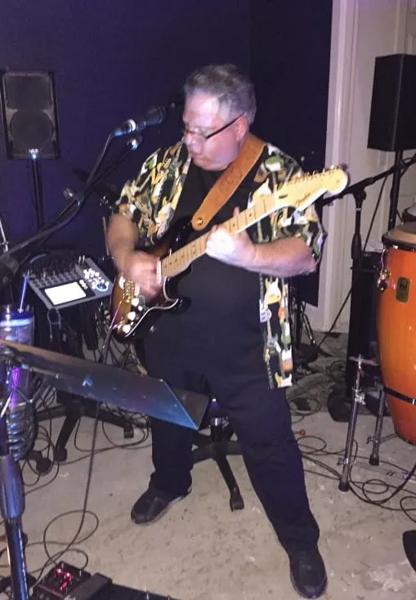 Tony Raiano playing guitar