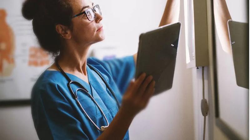 Female doctor looking at scan results