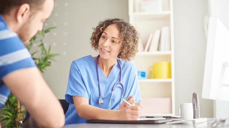 Young male speaks to doctor about prevention options for HIV.