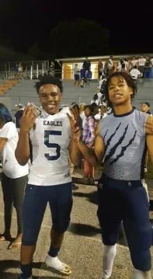 DJ and teammate on football field