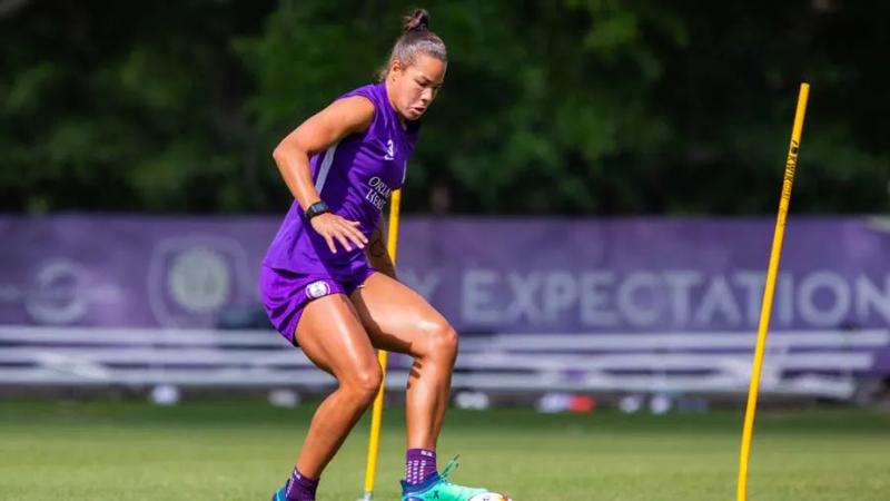 Toni Pressley kicking a soccer ball