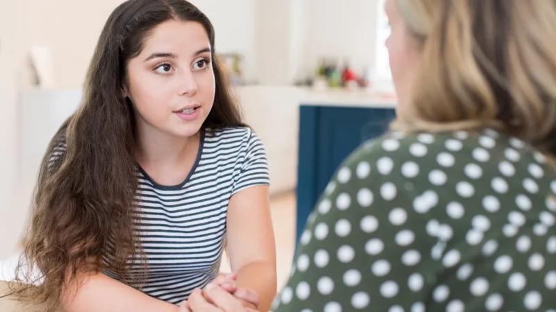 Mother speaking to daughter
