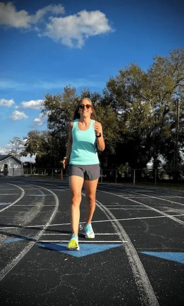 Lady walking on a track