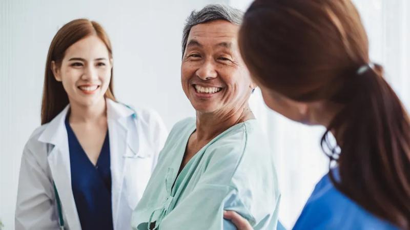Patient speaking with doctor and nurse