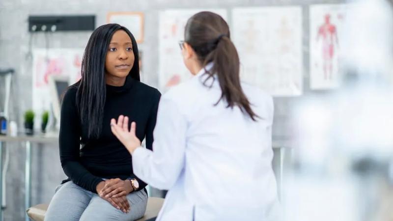 Woman speaks with doctor