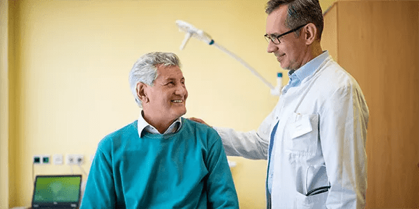 doctors hand on patient's back