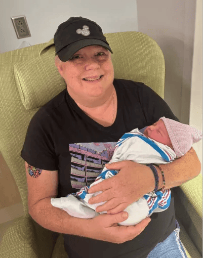 Lady holding new born baby